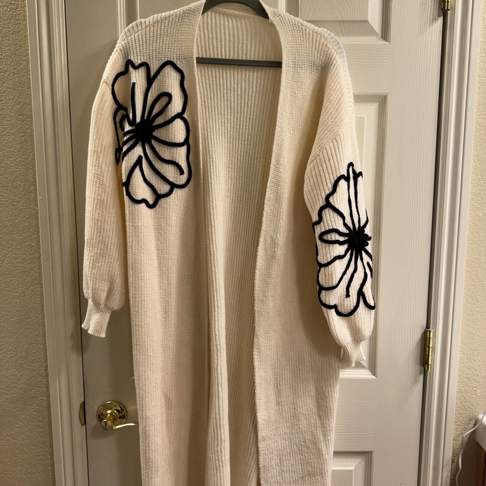 Elegant Cream Open-Front Sweater with Black Floral Design